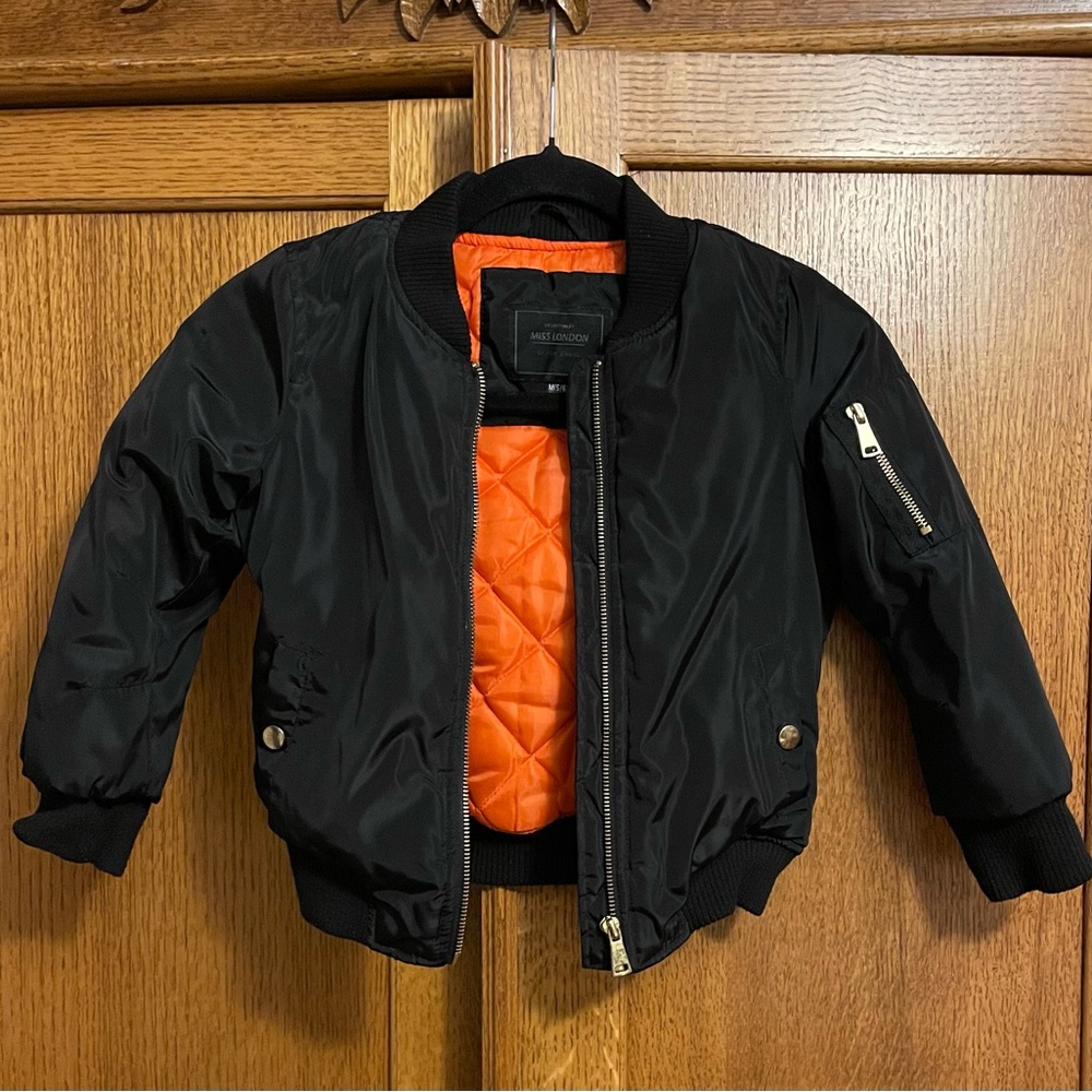 Boys Miss London Black Jacket with Orange Lining. Size 6
